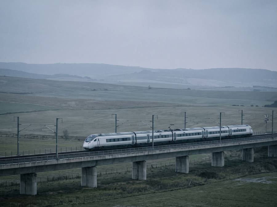 Modern electric train crossing a viaduct