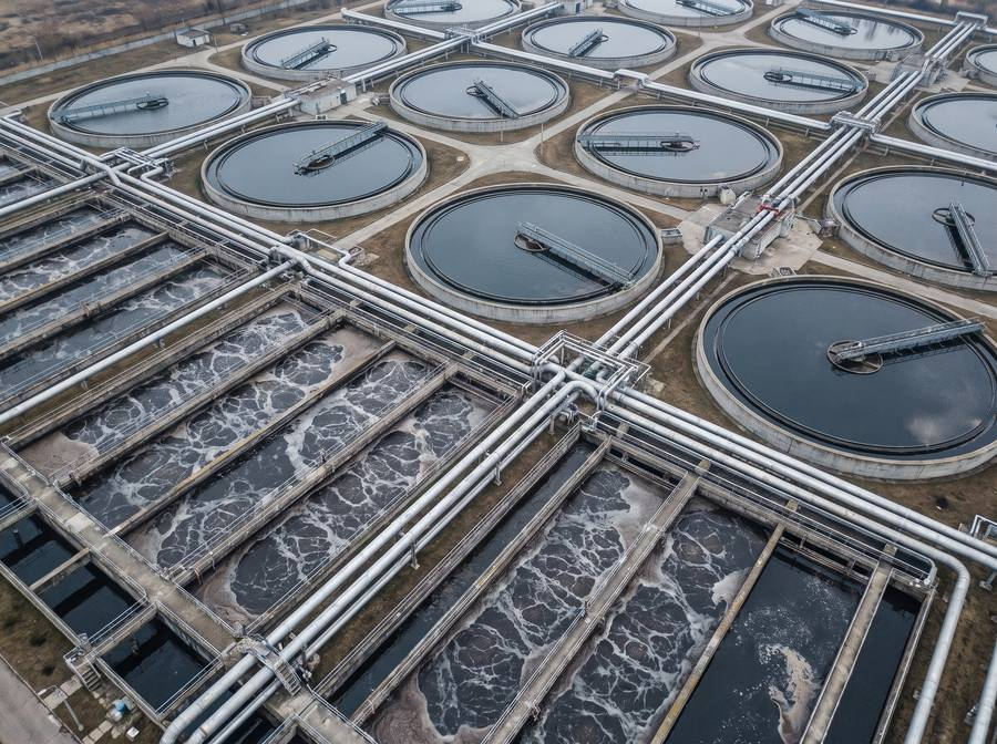 Wastewater treatment plant with circular clarifiers and aeration basins